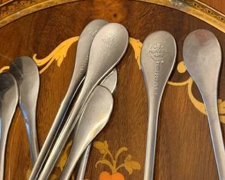 Stainless steel and Revere Ware spoons on inlaid tray
