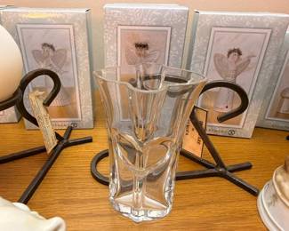 Crystal vase with iron stand and angel figurines