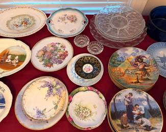 Collector plates with floral and figural designs