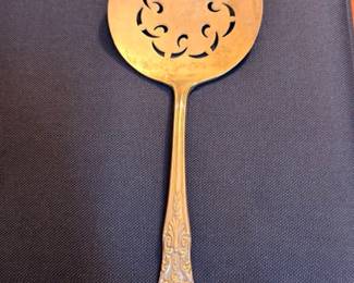 Silver pierced bonbon serving spoon, ornate floral handle