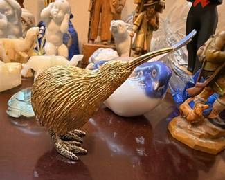 Gold-toned kiwi bird figurine and porcelain figurines