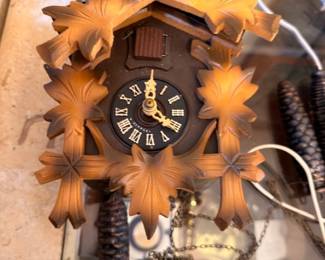 Black Forest cuckoo clock with pinecone weights
