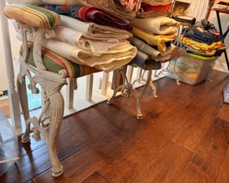 Vintage linens and tablecloths on antique iron base