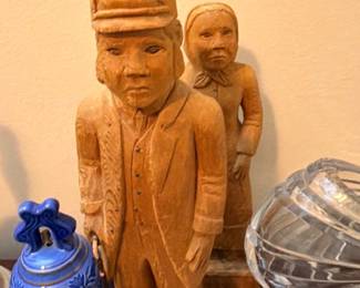 Hand-carved wood figural sculpture and Bristol blue glass