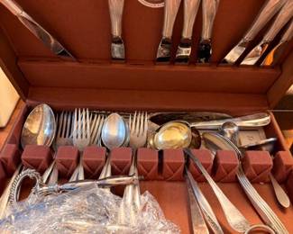 Silverplate flatware chest with serving pieces and crystal