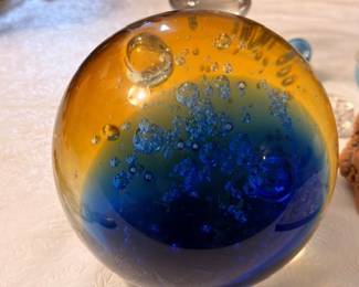 Studio art glass paperweight with blue and amber