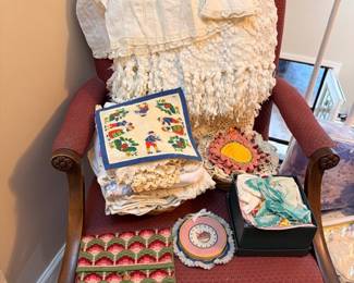 Antique chair with vintage linens and christening dress