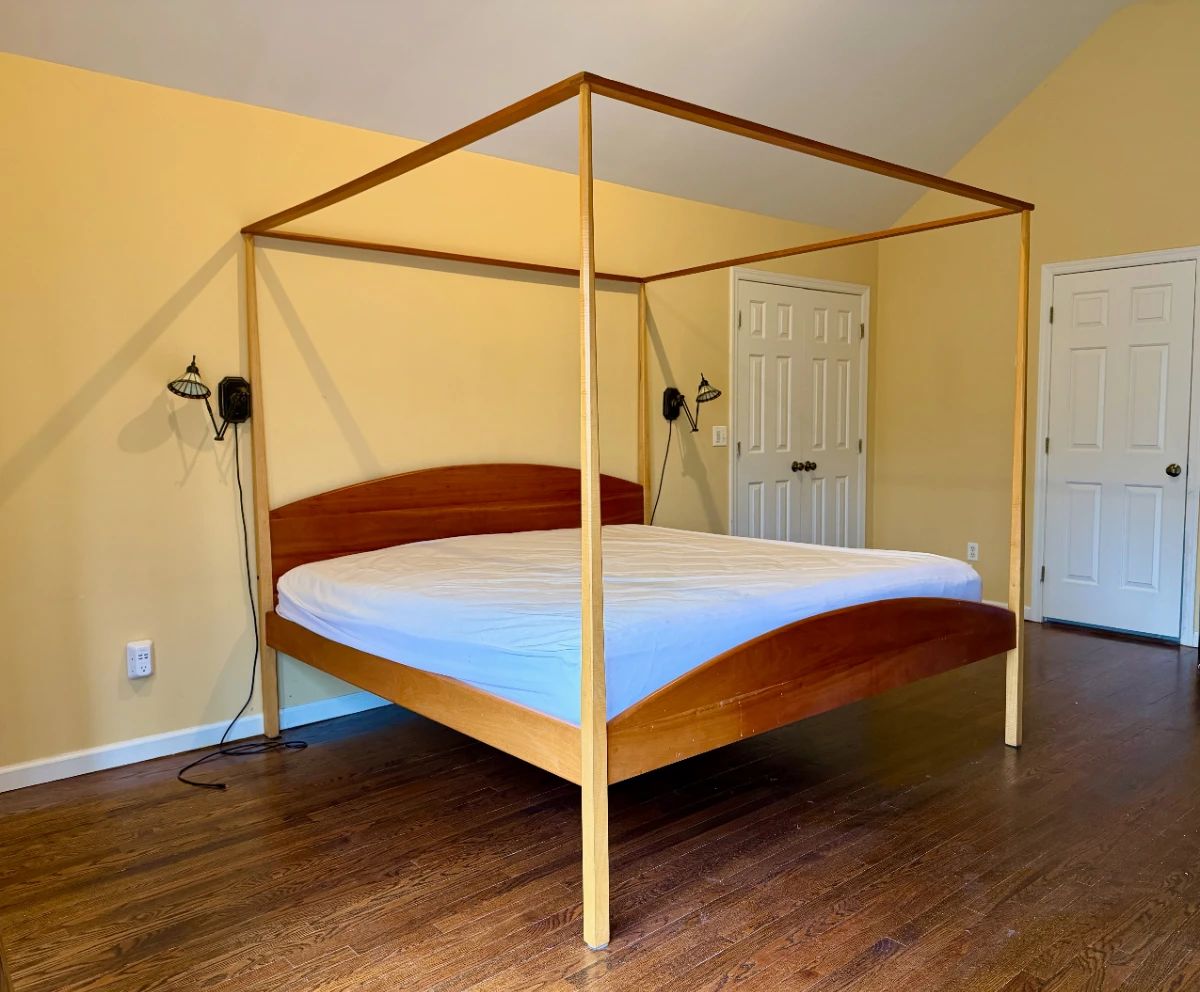A cherry and curly maple canopy bed from Pompanoosuc Mills (originally $2,600) with detachable poles.