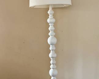 A white floor lamp