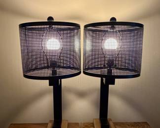 Set of two modern lamps with black mesh shades and wood bases. Perfect for nightstands or a living space. Clean, versatile, and easy to style.