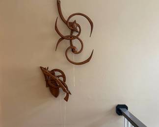 Dave Roy “Cascade” carved wood kinetic wall sculpture with flowing spiral design; currently needs a new string to restore movement but still displays beautifully.