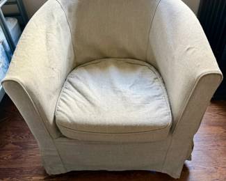 A fabric covered chair.