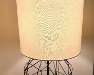 Pair of modern wire base lamps with neutral shades. Clean lines and warm light.