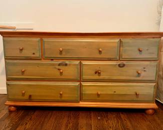 9-drawer wood dresser with rustic two-tone finish, sturdy and functional.