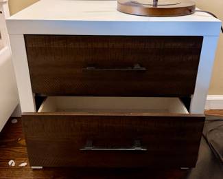 A queen bedroom set. Includes: Queen bed frame with built-in storage drawers, 1 nightstand, 2 dressers (one tall, one wide), with a Large matching mirror. Overall in excellent condition. Very clean, solid, and looks great in a room. Modern wood + white finish.