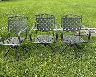 Three wrought iron swivel patio chairs 