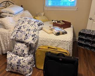 Suitcases, shoe rack, blankets and pillows