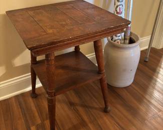 Antique wooden end table with turned legs and lower shelf.. Eastlake style