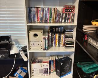 Multiple cds, dvds, vhs, and electronic equipment 
