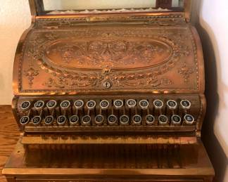 Antique ornate brass cash register manufactured by the National Cash Register Company (NCR) of Dayton, Ohi