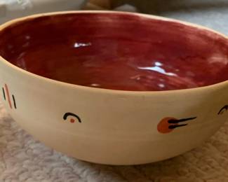 Two tone bowl with symbolic motifs.