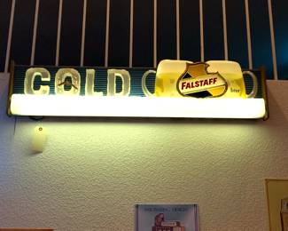 This Falstaff Beer Electric Sign is a rare mid-century design manufactured in St. Louis, Missouri. It features a lighted "ice" strip at the bottom and "COLD" spelled out in ice block lettering.