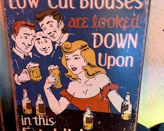 Vintage-style "Low Cut Blouses" tin sign 