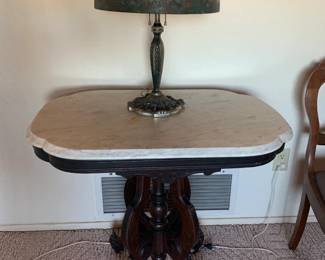 Marble top antique table with Tiffany-style lamp