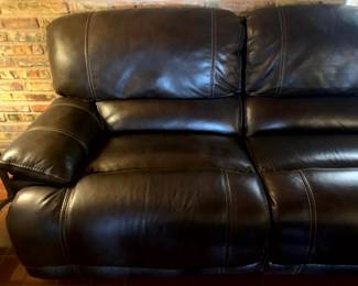 Long Sofa with faux leather upholstery, two end seats recline,
