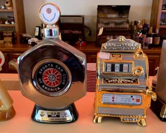 vintage 1976 Jim Beam Sports Car Club of America (SCCA) decanter. Produced by Regal China, this silver-finished porcelain decanter commemorates the SCCA and originally contained 100-month-old Kentucky Straight Bourbon and vintage Ezra Brooks "Liberty Bell" slot machine decanter