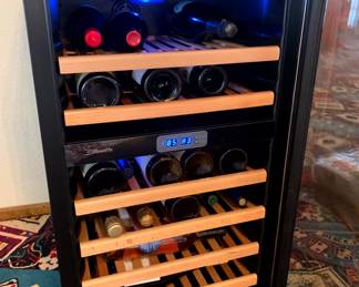 Wine Cooler, Features a contemporary yet classical look with stainless steel trim, soft LED lighting, and wood-trimmed wire wine racks.