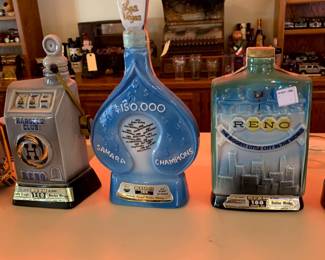 1968 decanter features a slot machine design created for the famous Harold's Club in Reno, 1971 Jim Beam "Sahara Champions" decanter, 1968 Jim Beam "Reno Centennial" decanter