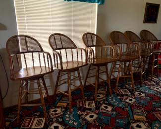 Set of 6 wood and rattan barstools, all made to rotate.