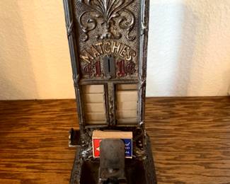 Vintage Northwestern "Sellem" 1-cent match dispenser, Manufactured starting around 1912, this cast-iron countertop machine was designed for saloon or cigar store display, dispensing a box of matches for one penny..