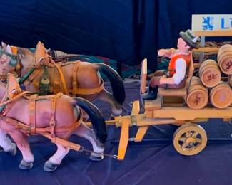 Vintage Löwenbräu horse-drawn beer barrel wagon display