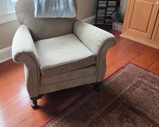 Beige Casual Chair, Large Area Rug; CDs, CD Storage Stand