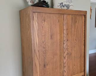 Oak Wood Armoire; Large Glass Jar with Shells; Decorative Pillow