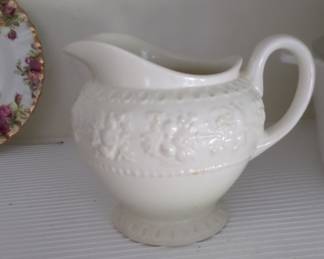 White Ceramic Creamer with Embossed Floral Design