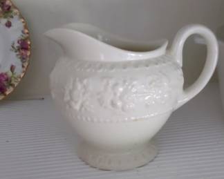 White Ceramic Creamer with Embossed Floral Design