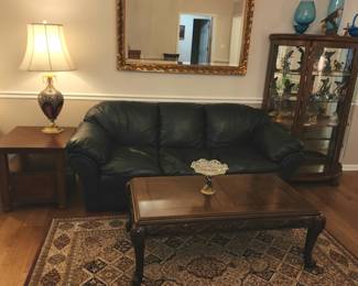 Navy leather sofa, coffee table, area rug