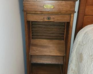 Tambour fronted cabinet - Poole Bros. plaque on front