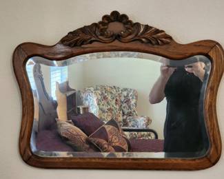 Beveled wall mirror with wooden frame