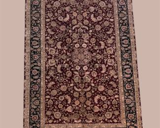 Wool area rug with a balanced and refined design