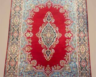 A refined rug with layered design elements