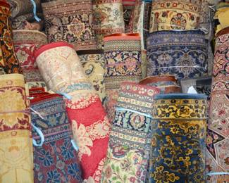 A large selection of rugs displayed throughout the showroom