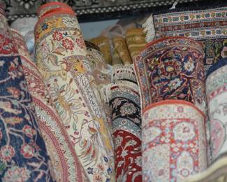 Rows of rugs offering a wide range of styles and colors