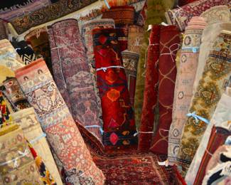 A full section of stacked rugs ready to browse