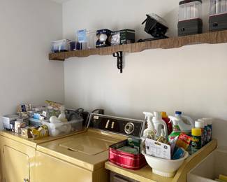 Laundry room harvest gold 1970s washer & dryer, various cleaners and light bulbs