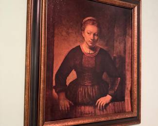 Young woman at an open half door by Rembrandt reproduction