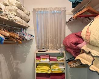 Closet with towels, comforters, sheets